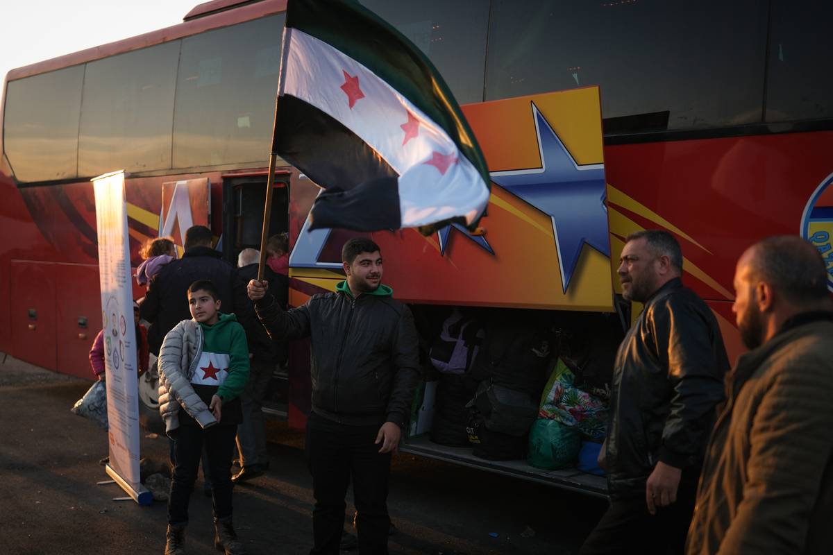 Vehicle carrying residents of Damascus arrive at Harasta Bus Terminal in the evening hours in Damascus, Syria on January 15, 2025. [Erçin Ertürk - Anadolu Agency]