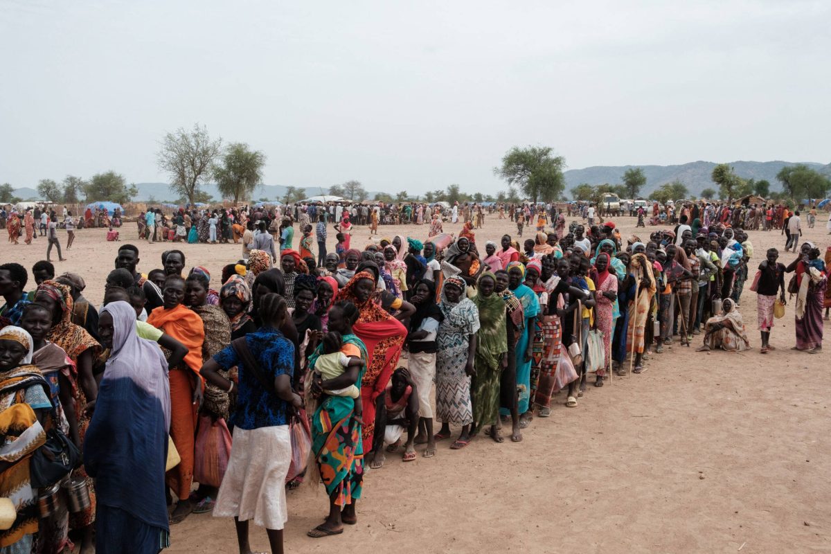 People line up to register for a potential food aid delivery at a camp for internally displaced persons (IDP) in Agari, South Kordofan, on June 17, 2024 [Guy Peterson/AFP via Getty Images]