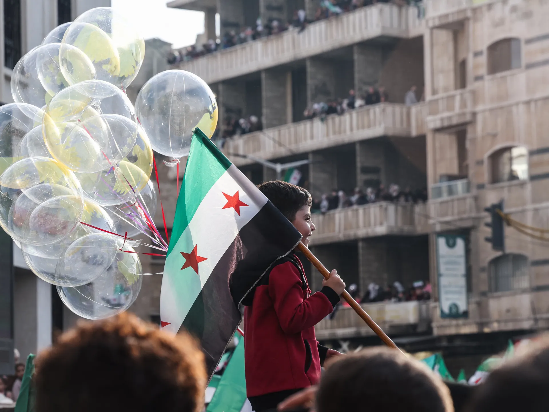Hope, flags, fireworks as Syria starts to celebrate a year without al-Assad | Syria’s War News