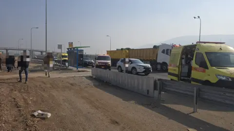 Magen David Adom An ambulance and other vehicles at the scene of an attack in Israel (26/12/25)