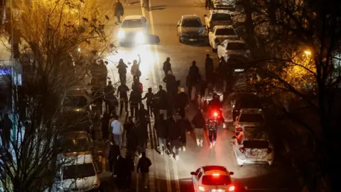 WANA via REUTERS Iranians protest on a street in Tehran, Iran (8 January 2026)