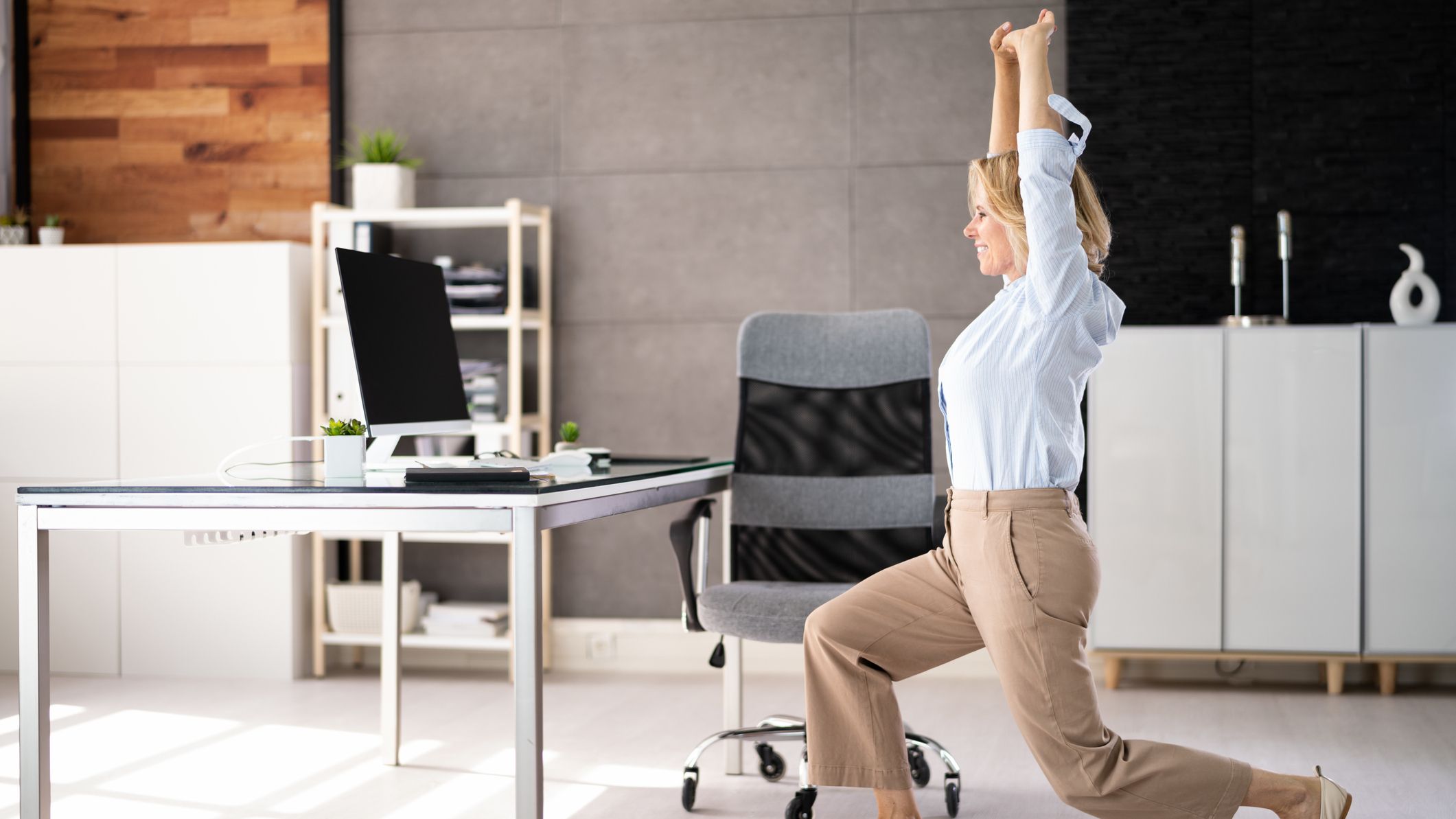 A Johns Hopkins-trained spinal surgeon says these are the two stretches you should be doing if you work at a desk