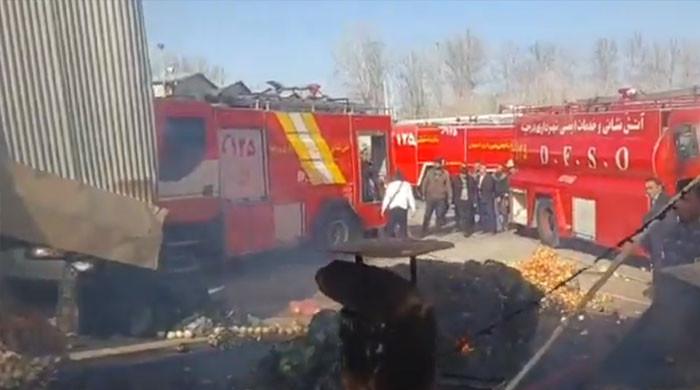 Iranian military helicopter crashes into fruit market, four dead